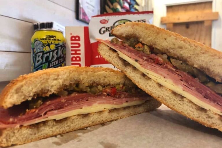 The best Muffuletta sandwich outside of New Orleans with Provolone, Capicola, Mortadella, Salami, and an Olive Salad on Muffuletta bread at Rosie’s Sidekick Sandwich Shop. The Best Muffuletta in Chicago.