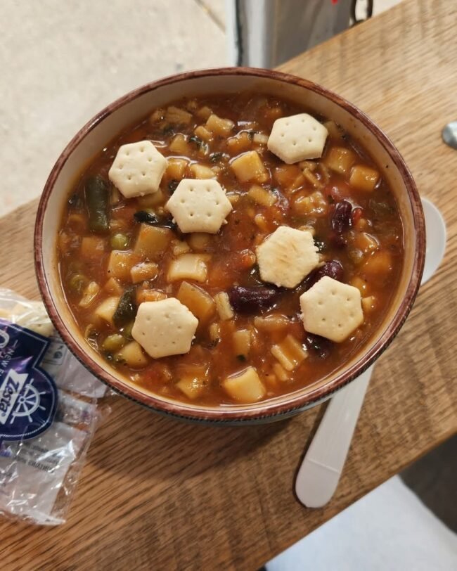 Homemade Italian minestrone soup with vegetables, beans, and pasta at Rosie’s Sidekick Sandwich Shop