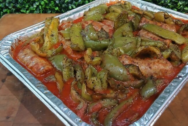 Homemade Italian sausage and sweet green pepper tray in homemade marinara catered from Rosie's Sidekick Sandwich Shop